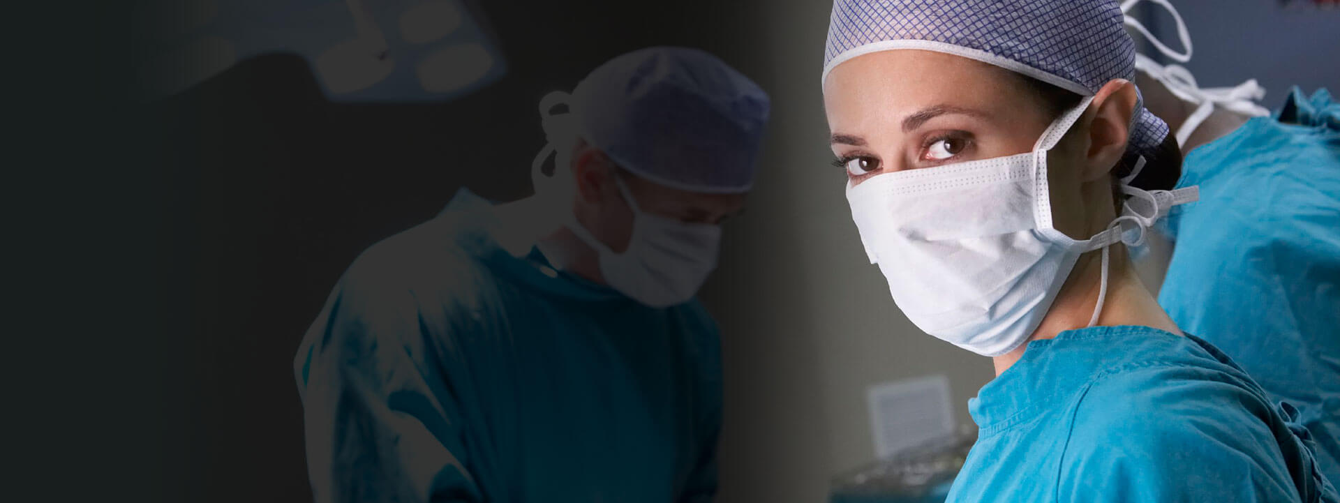 scrub nurse masked up and doing surgery