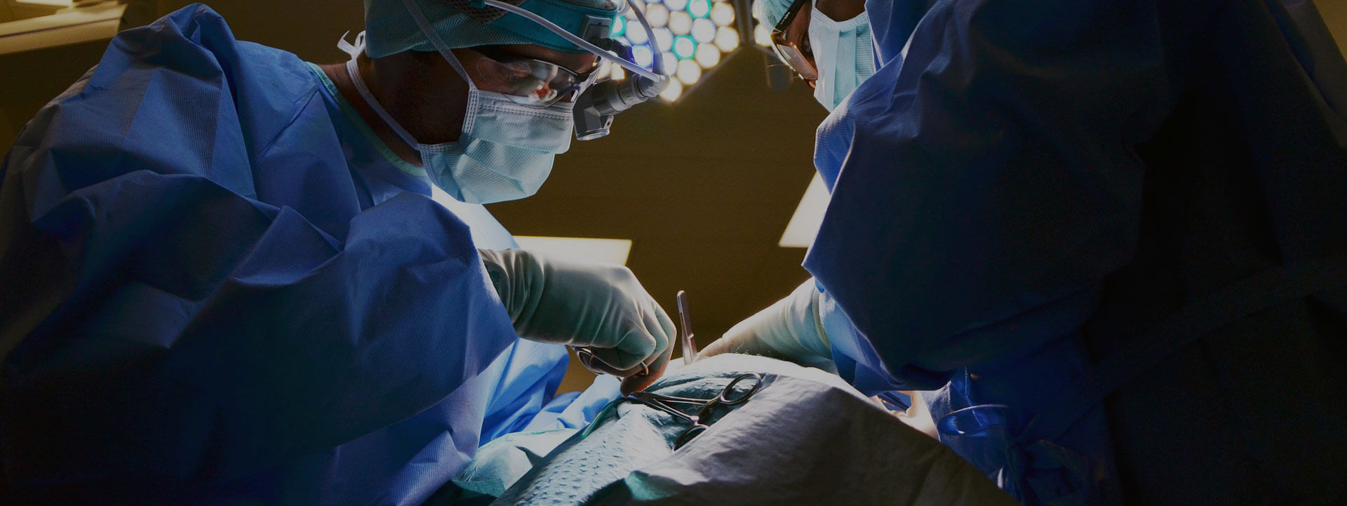 surgeons doing surgery on a patient